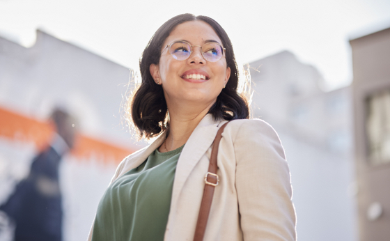 Business woman, vision and worker outdoor in city with job travel and thinking. Urban, face and female professional with bag for career and commute to work feeling happy and proud from success